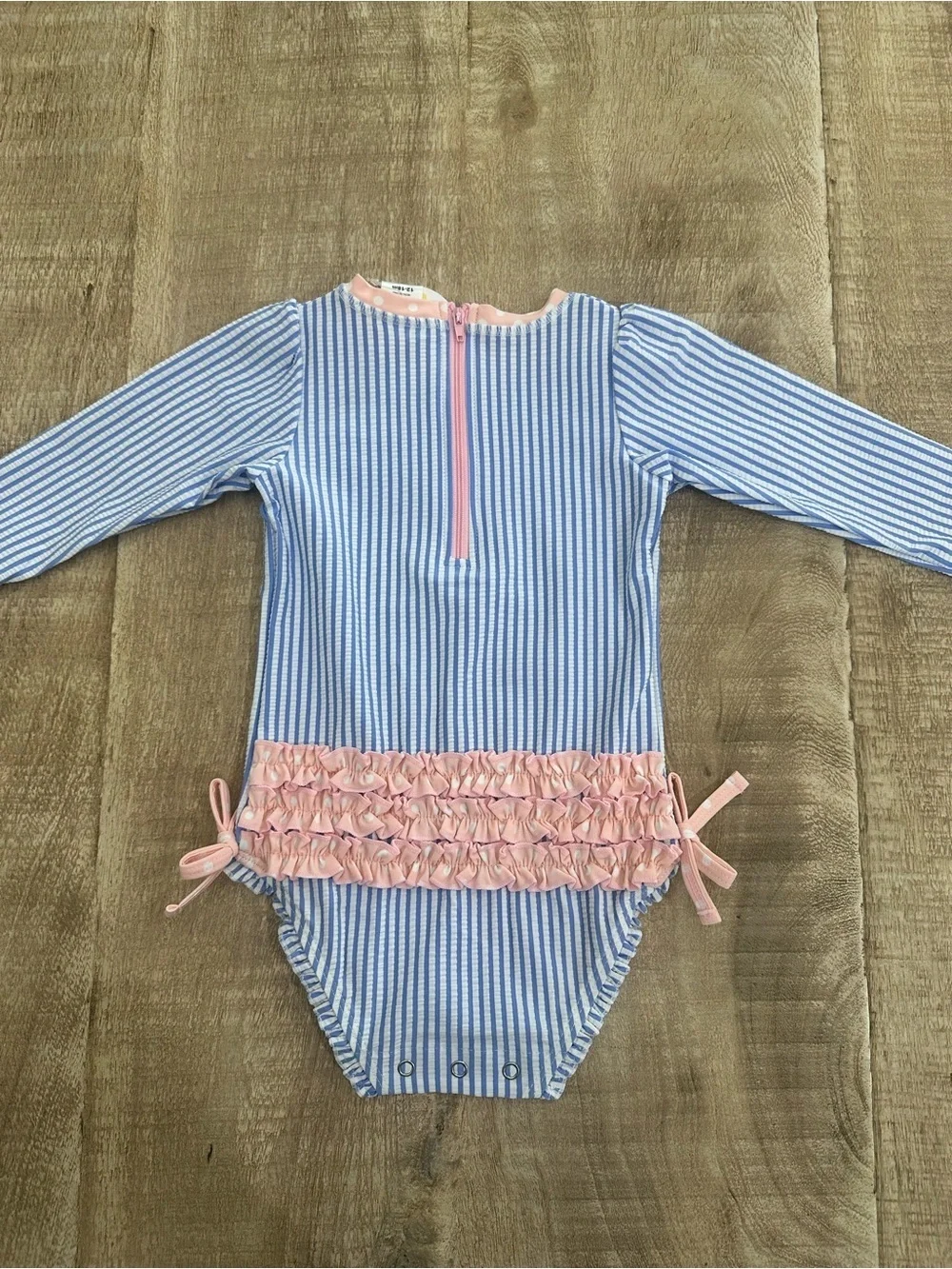 RuffleButts Blue Seersucker Rash Guard One Piece | 12–18M | UPF 50+